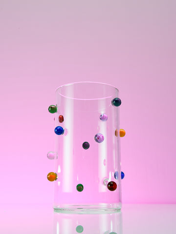 Dot Vase by Maison Balzac on a glowing purple background. 