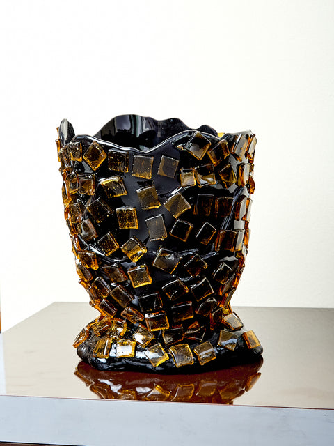 Decorative resin vase with mosaic tile design.