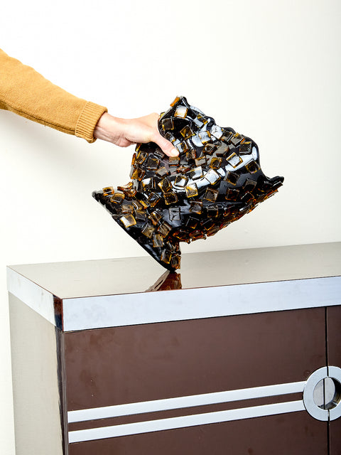 Decorative resin vase with mosaic tile design.